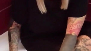 Tattooed blonde MILF washes her feet