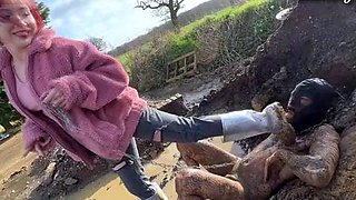 Extreme ballbusting in the mud Miss Eva Ray