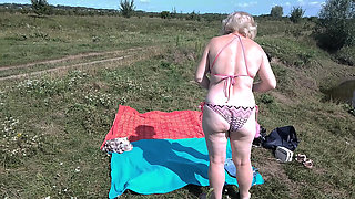 Mature milf and young girl sunbathing on a wild beach without clothes naked asses big tits big ass natural tits