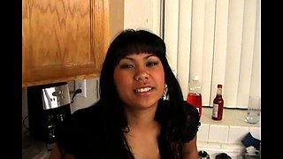 Cute Asian Girl Sucks a Big Black Cock and Gets Fucked in the Kitchen