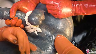 Two latex dominatrix sissy femdom anal fisting