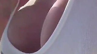 Boobs and Pierced Nipples Playing on the Beach