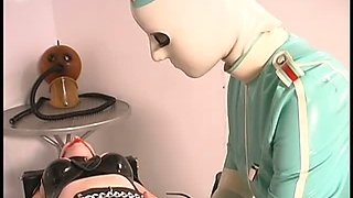 Latex Nurse Straps Down Her Patient