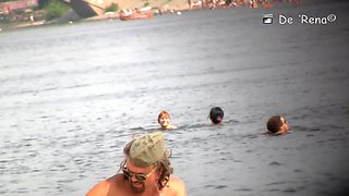 Naked people are having some good time on the beach