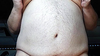 Chubby guy stands and cums