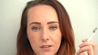 Extreme Close up Blue Eyed Redhead Smoking