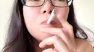 Smoking Asian Girl Smokes Multiple Cigarettes Exposing Her Bouncy C Cup Boobs